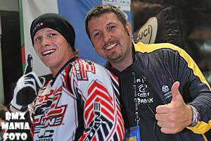 Sam Willoughby celebrates his UCI Madrid SX win with BMX Australia's High Performance BMX Team Coach, Wade Bootes.